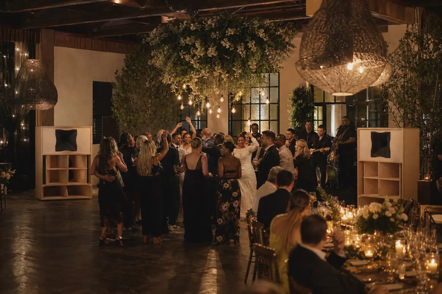 Wedding guests dancing between TMS wooden horn speakers